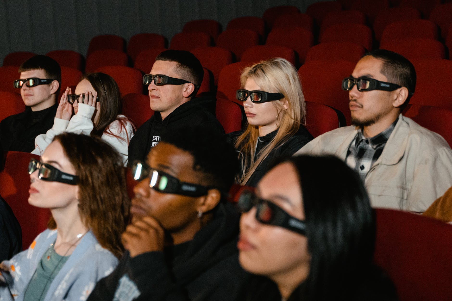 people watching movie while wearing glasses