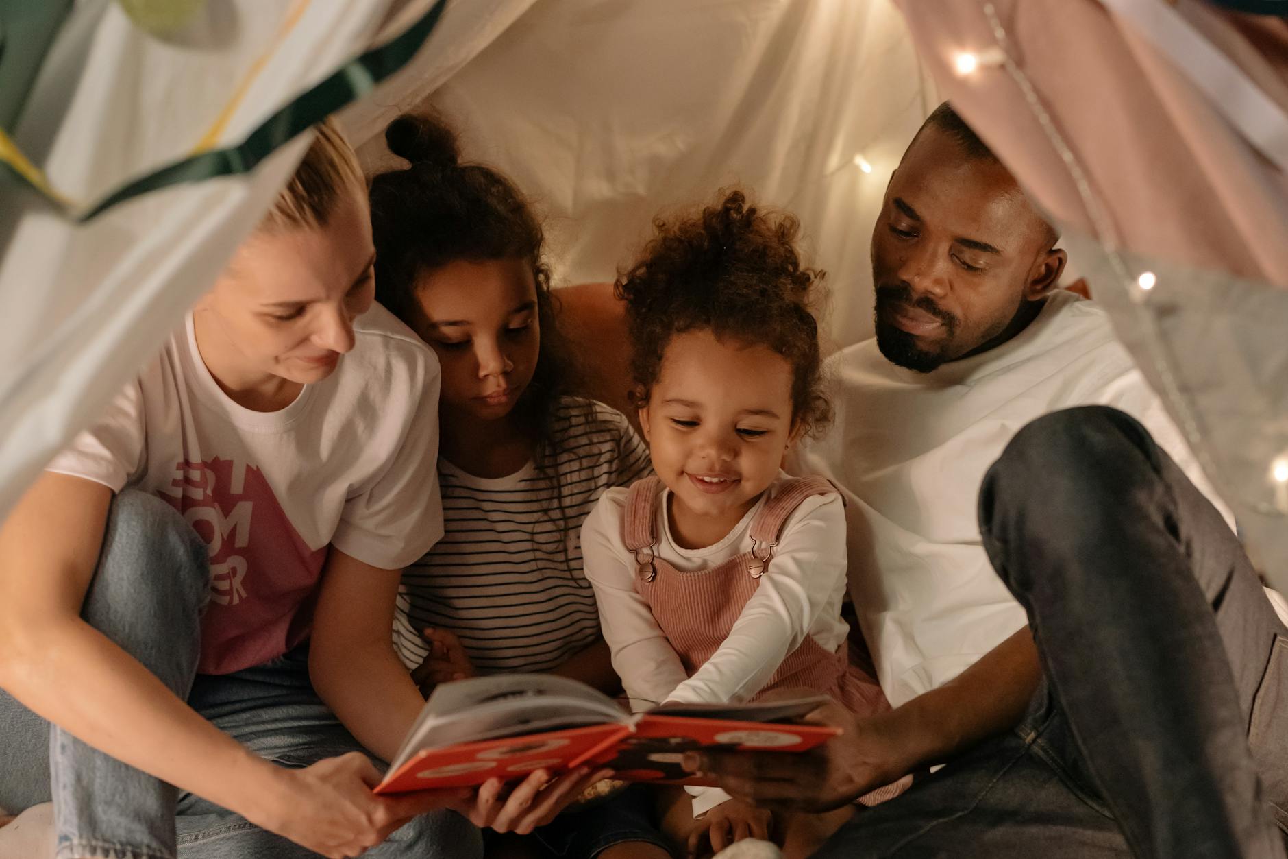 a family reading a book together
