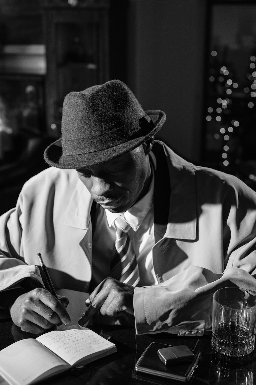 photo of man taking notes